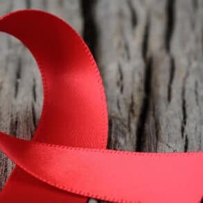 red ribbon on a tree truck
