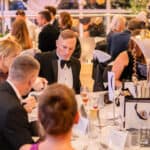 People sat at tables at the charity dinner