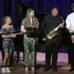 Young musicians standing on the stage