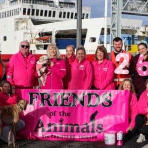 Friends of the Animals-team members with Red Funnel staff in front of a ferry