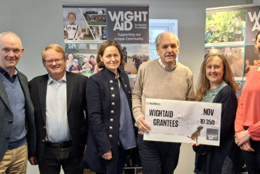Geoff Underwood, David Jackson, representatives of the Seaview Sailing Trust and Brighstone Primary School