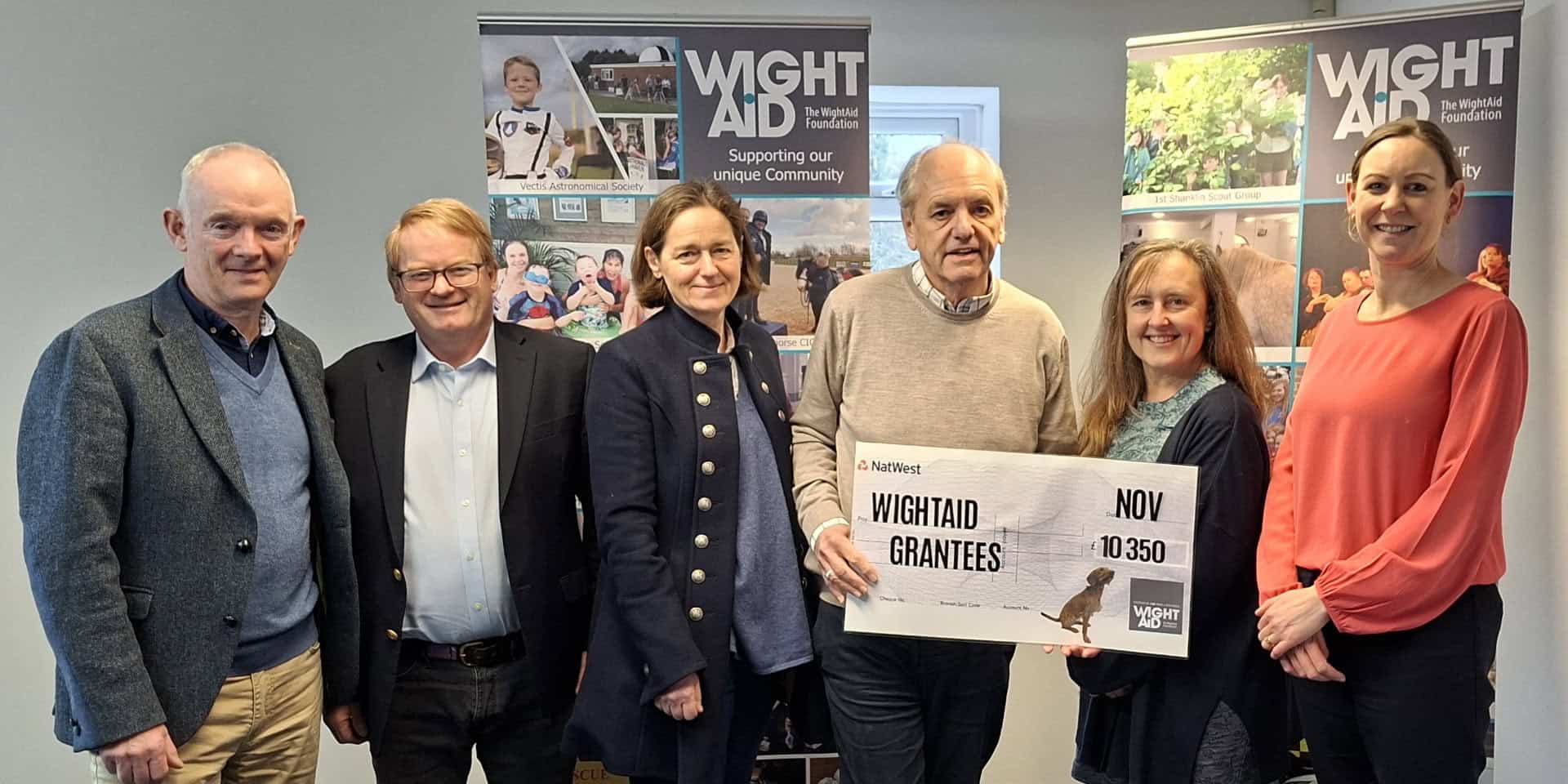 Geoff Underwood, David Jackson, representatives of the Seaview Sailing Trust and Brighstone Primary School