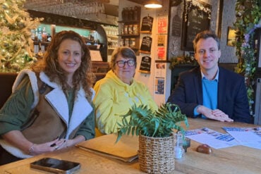 Joe Robertson meeting with local businesses