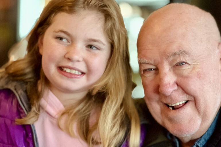 John Howe with his granddaughter