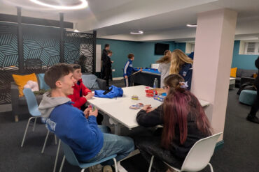Young people hanging out in the lounge area of Sandown Town Hall