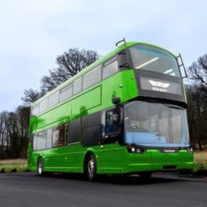 Green bus on country road