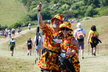 People dressed in sunflower patterned shirts on Walk the Wight