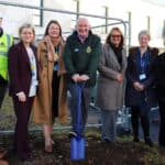 Members of NHS and building staff breaking ground on the site of the extension