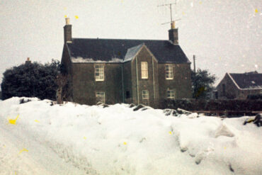 farmhouse in the winter snow of 1962-63