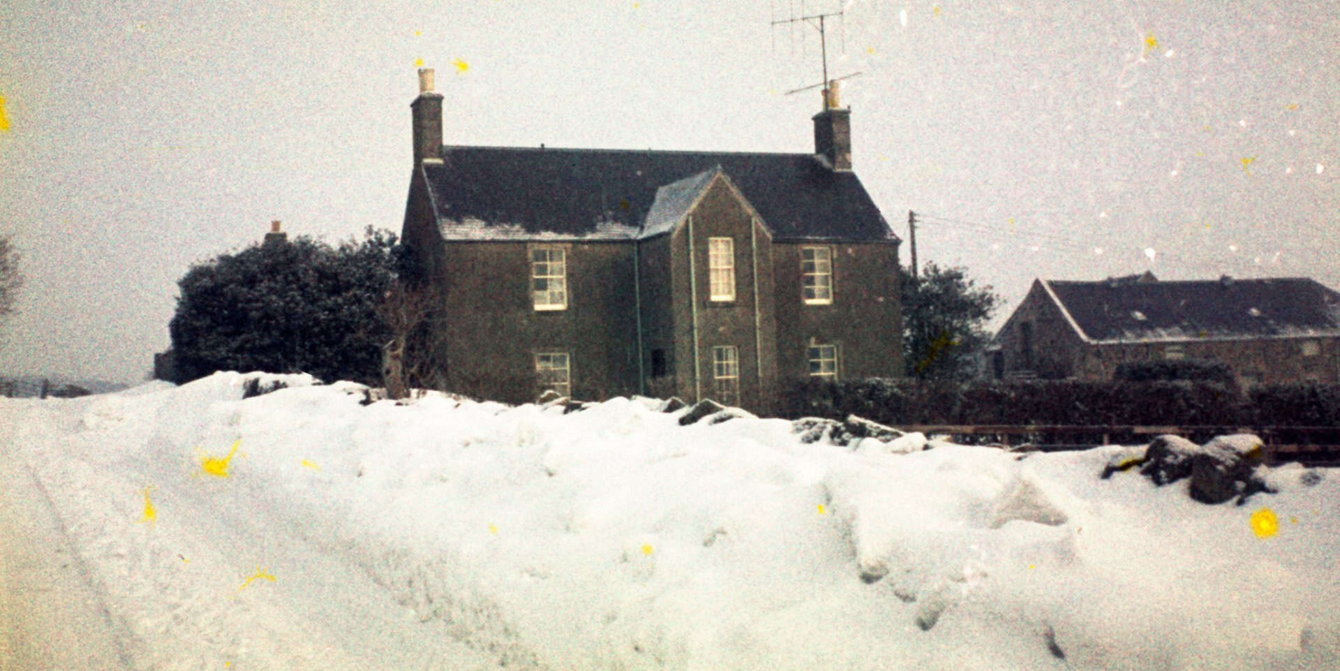 farmhouse in the winter snow of 1962-63