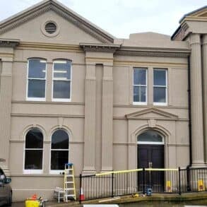 Brick cottage part of Sandown Town Hall now boosts an array of 9 boxes on the facade and more to the side