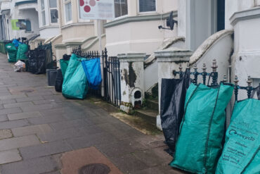 Bin bags on George Street property railings