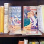 Books on a shelf at Goose Book Shop by Vincent Dupont-Blackshaw
