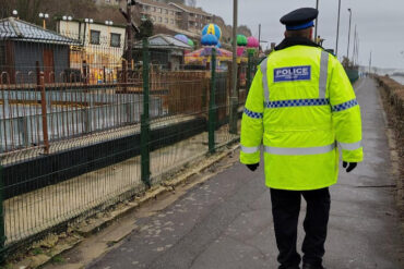 Policeman walking along shanklin seafront