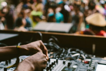 DJ playing music to woodland audience