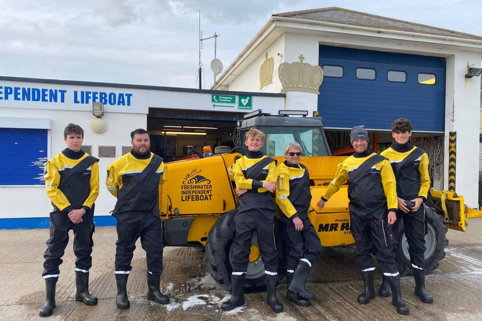 Lifeboat crew outside the lifeboat station