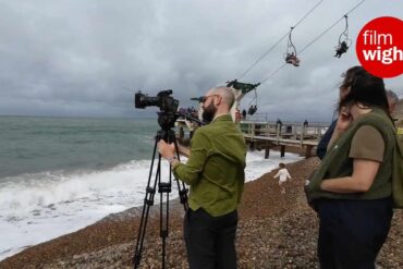 Film crew shooting on the beach at alum bay