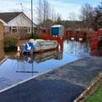 large puddle of flood water in thr street