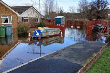 large puddle of flood water in thr street