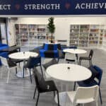 Tables and chairs in the common area at Lionheart School