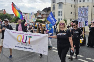 Out on an Island team taking part in Pride Parade
