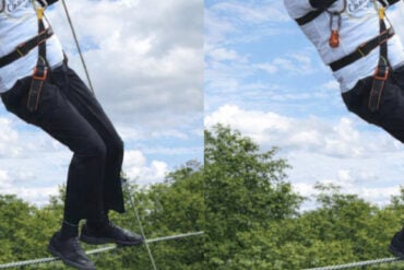 man in harness on a tightrope cropped 2
