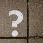 question mark painted on the grey pavement