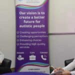 two women sitting ppposite each other at Autism Awareness organisation