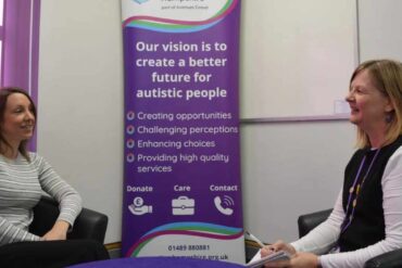 two women sitting ppposite each other at Autism Awareness organisation