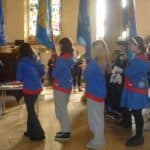 Girlguides taking part in the flag parade at Newport Minster