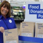 Tesco staff member with the donation bags