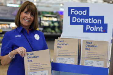 Tesco staff member with the donation bags