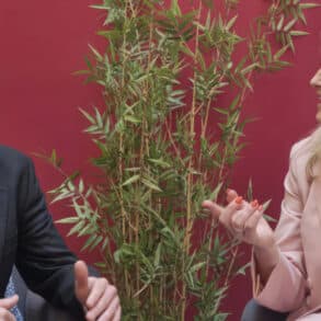 Joe Robertson and Penny Lancaster sitting and chatting to each other