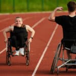 An inspiring couple with disability showcase their incredible determination and strength as they train together for the Paralympics pushing their wheelchairs in marathon track.