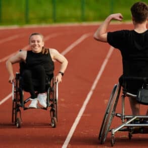 An inspiring couple with disability showcase their incredible determination and strength as they train together for the Paralympics pushing their wheelchairs in marathon track.