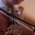 a young boy playing the violin