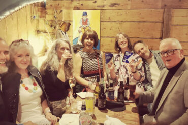 friends of Monkton Arts sitting around a table in the cafe