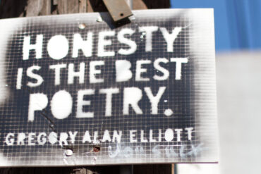 honesty is the best poetry sign attached to a telegraph pole