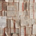 open books laid across each other to form a wallpaper