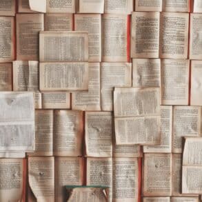 open books laid across each other to form a wallpaper