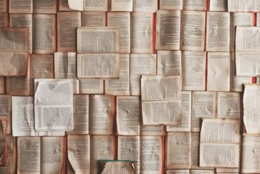 open books laid across each other to form a wallpaper