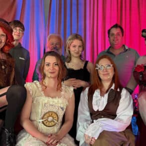 Time Nor Tide CIC players in costume posing on stage