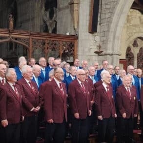 Cotswold and Newchurch Male Voice Choirs singing in the church