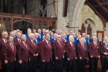 Cotswold and Newchurch Male Voice Choirs singing in the church