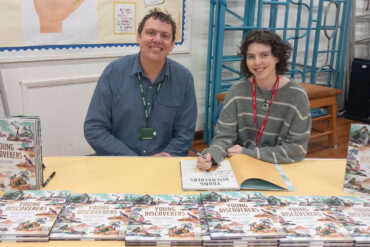 Daisy and Stephen signing books at Niton Primary School