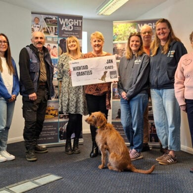 WightAID founder Geoff Underwood, WightAID trustee Brian Marriott, a representative from The Parenting Network, Steve Double from Operation Geranium , a representative from The Ickle Pickles Children Charity, donor/supporter Lisa Butler, of Rouse Ltd, a representative of Forever Wild at Heart, WightAID trustee Steve Porter, and the Wroxall Woollies