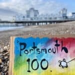 My Dog Sighs painting on the beach by the pier