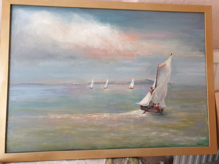 Bright sea scene with pinky blue sky and sailing boats racing