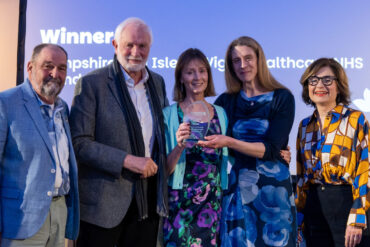 Volunteers and members of the Isle of Wight Parkinson’s Project Jim Foot, David Temple, Caroline Linton and Rebecca Verling, community physiotherapist, receive their Mali Jenkins Award from BBC Journalist Jane Hill