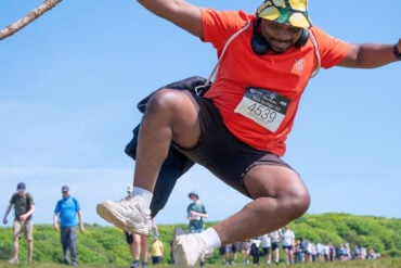 Walk the Wight walker jumping for joy